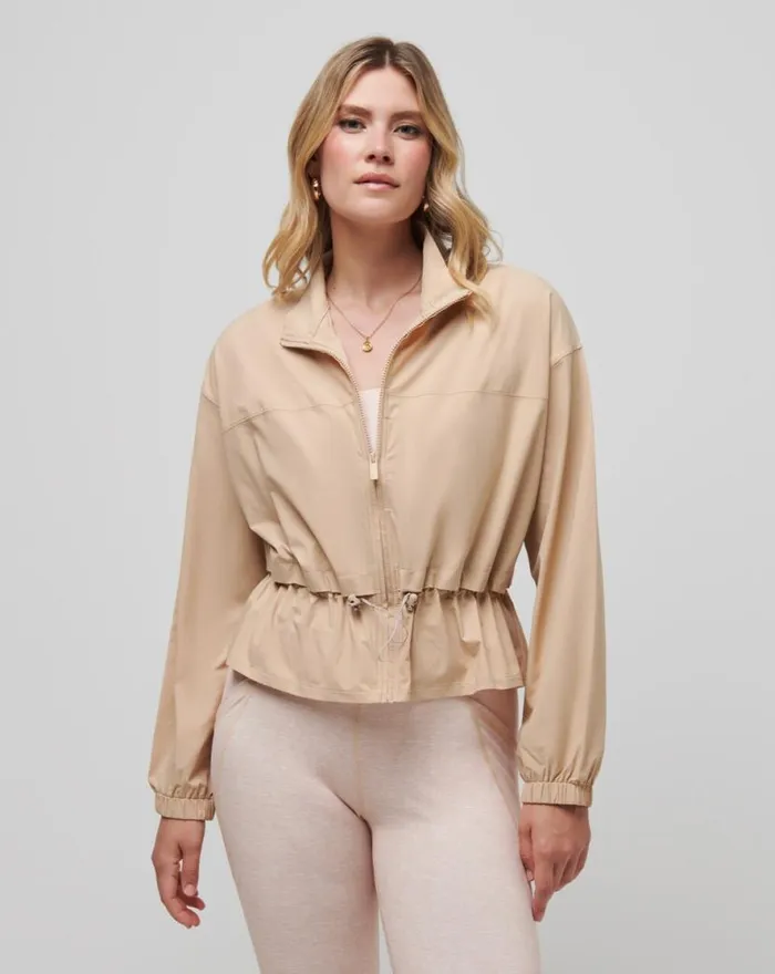 TravisMathew GIRLS WEEKEND TECH WOVEN JACKET Cuban Sand Women Jackets
