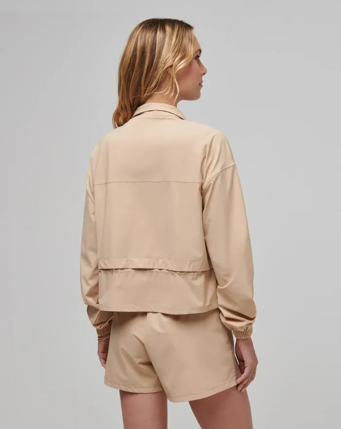 TravisMathew GIRLS WEEKEND TECH WOVEN JACKET Cuban Sand Women Jackets TravisMathew GIRLS WEEKEND TECH WOVEN JACKET Cuban Sand Women Jackets