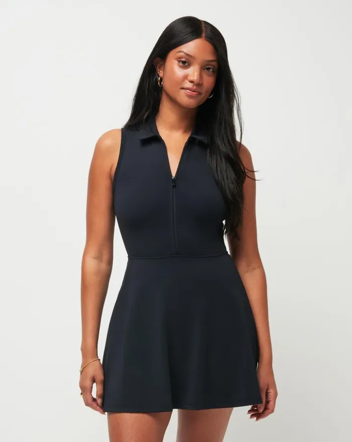 TravisMathew MOVEKNIT SLEEVELESS POLO DRESS Black Women Dresses
