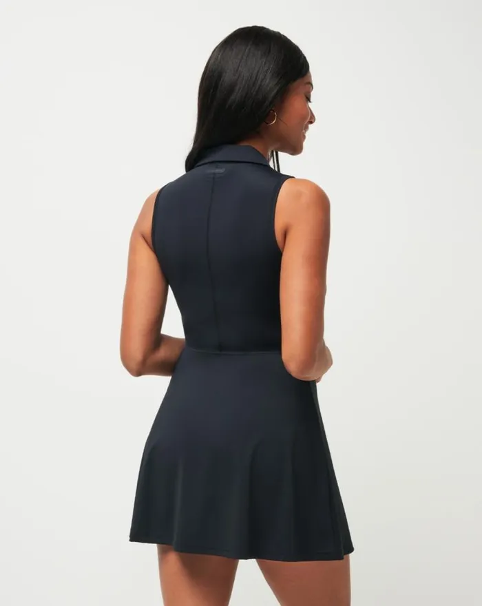 TravisMathew MOVEKNIT SLEEVELESS POLO DRESS Black Women Dresses TravisMathew MOVEKNIT SLEEVELESS POLO DRESS Black Women Dresses